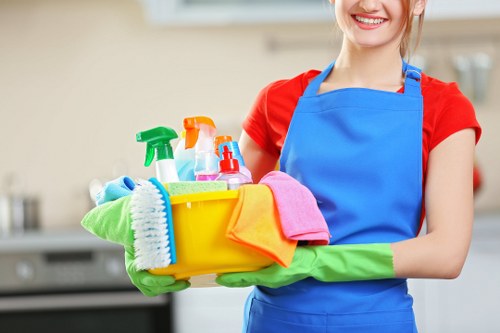 Technician preparing carpet cleaning equipment with safety focus